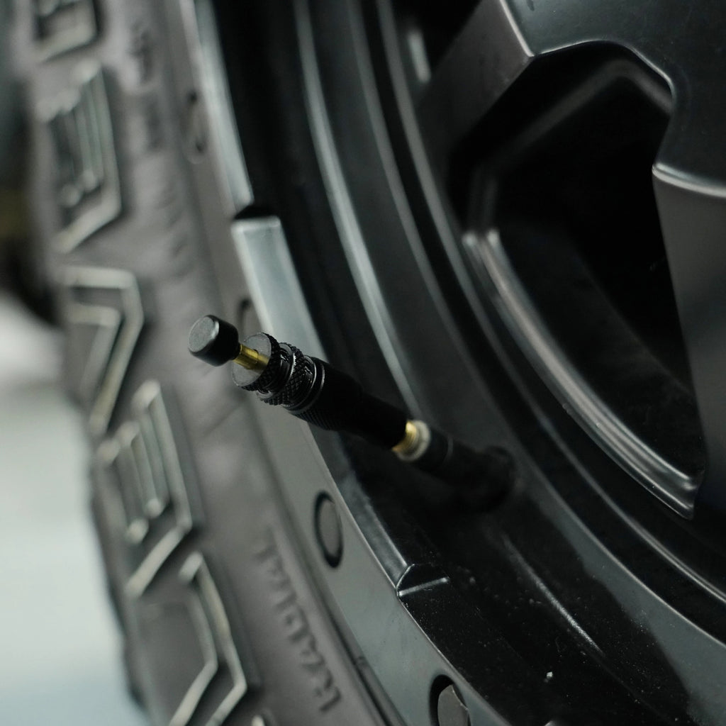 4wd tyre pressure monitor on a knobby tyre with rim