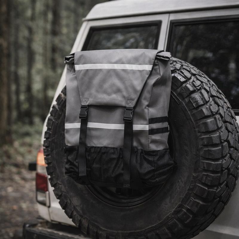 Backpack for back of car in grey with a forest background